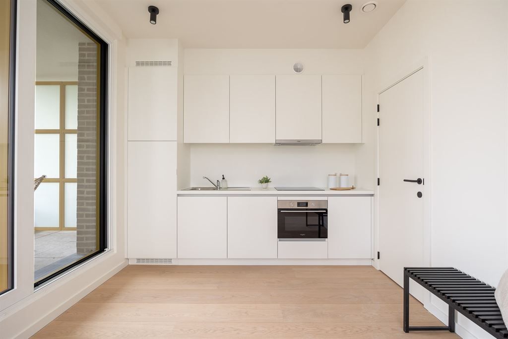 lichtrijk nieuwbouwappartement met terras foto 4