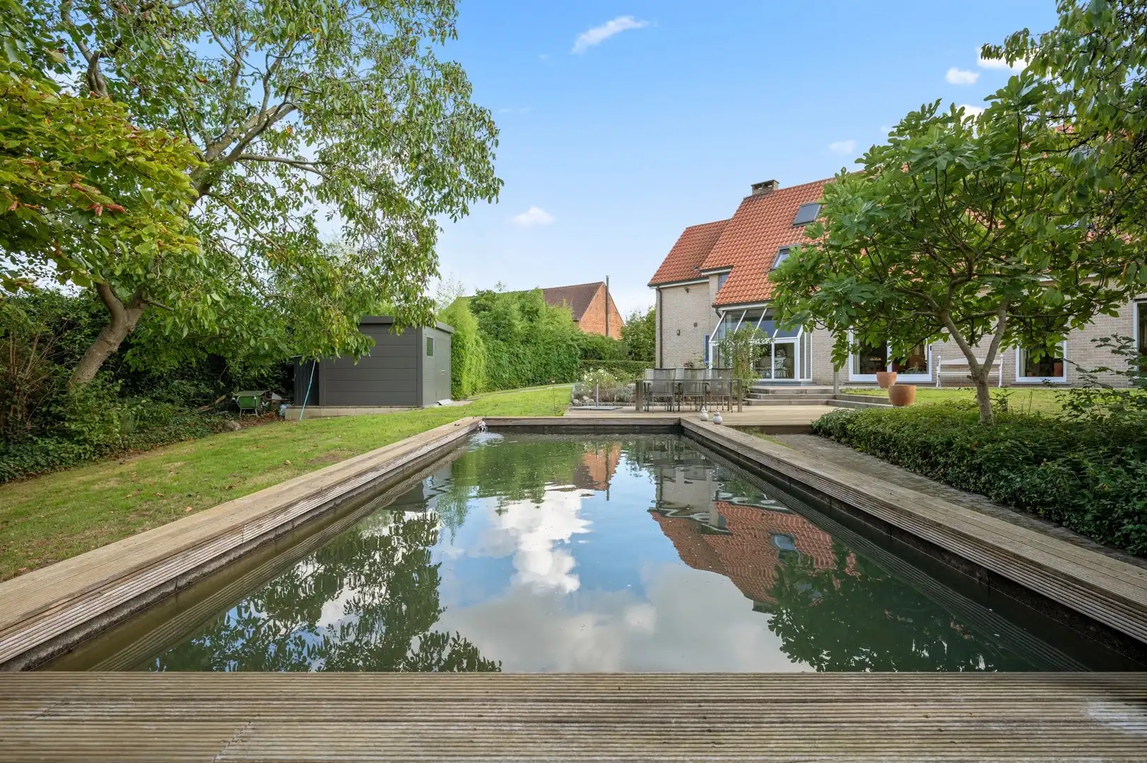 Ruime gezinswoning op een prachtig perceel van ruim 43 are met zwemvijver foto 28