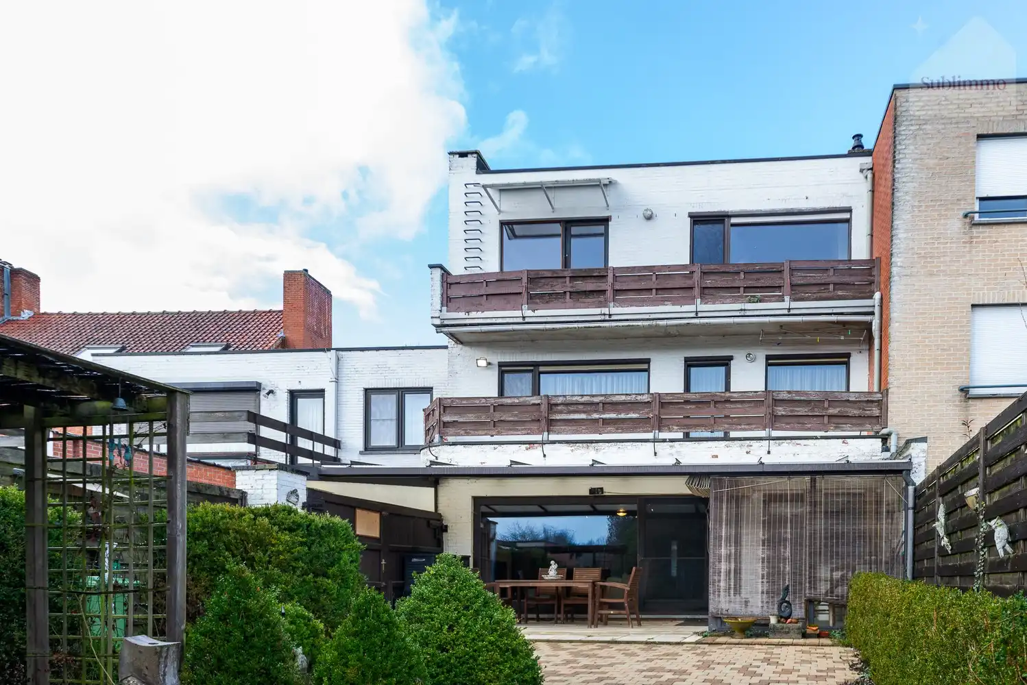 Opbrengsteigendom met 2 appartementen, tuin en garages te koop in Mol centrum foto 2