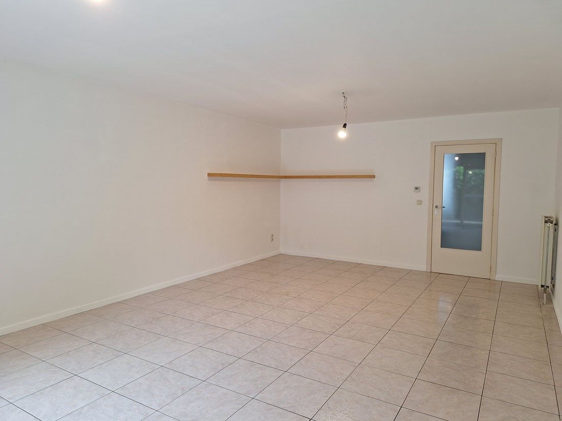 Stijlvol gelijkvloers appartement met terras en autostandplaats foto 7