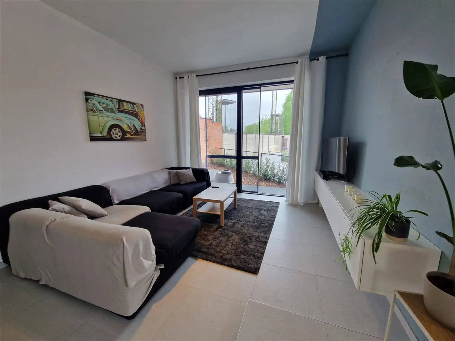 Ruim gelijkvloers appartement, 2 slpk, zuidgericht terras, garagebox, E-Peil 15 foto {{pictureIndex}}
