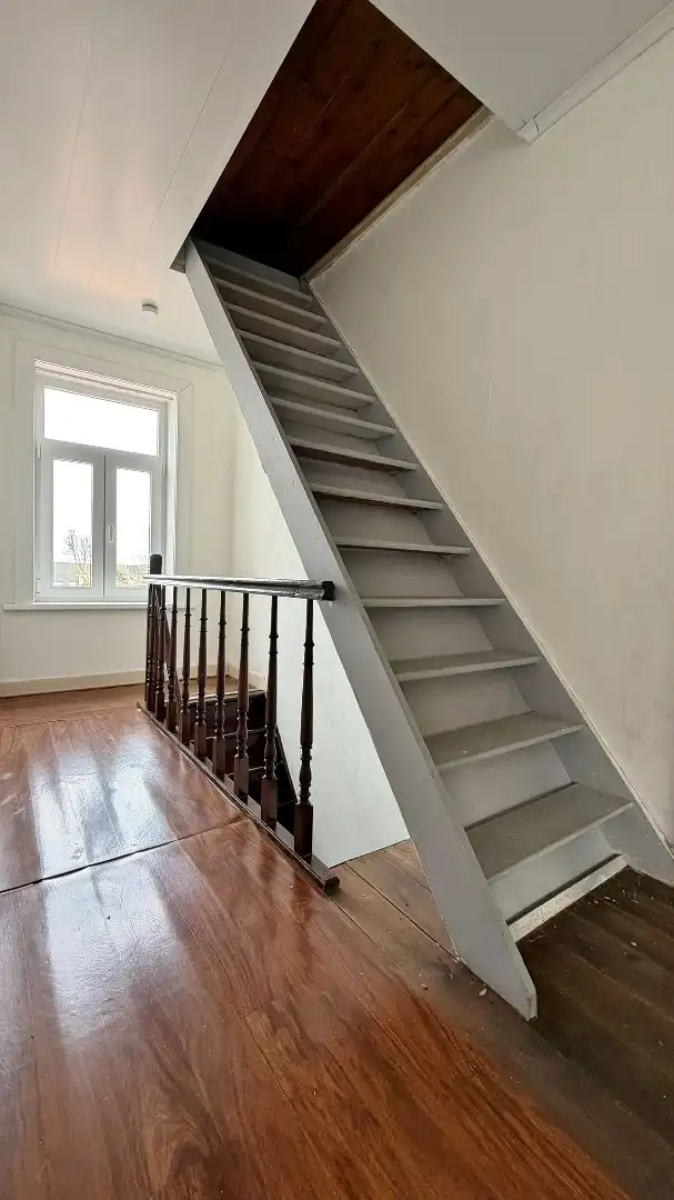 Charmante rijwoning met zonnige tuin in het rustige Woesten foto 9