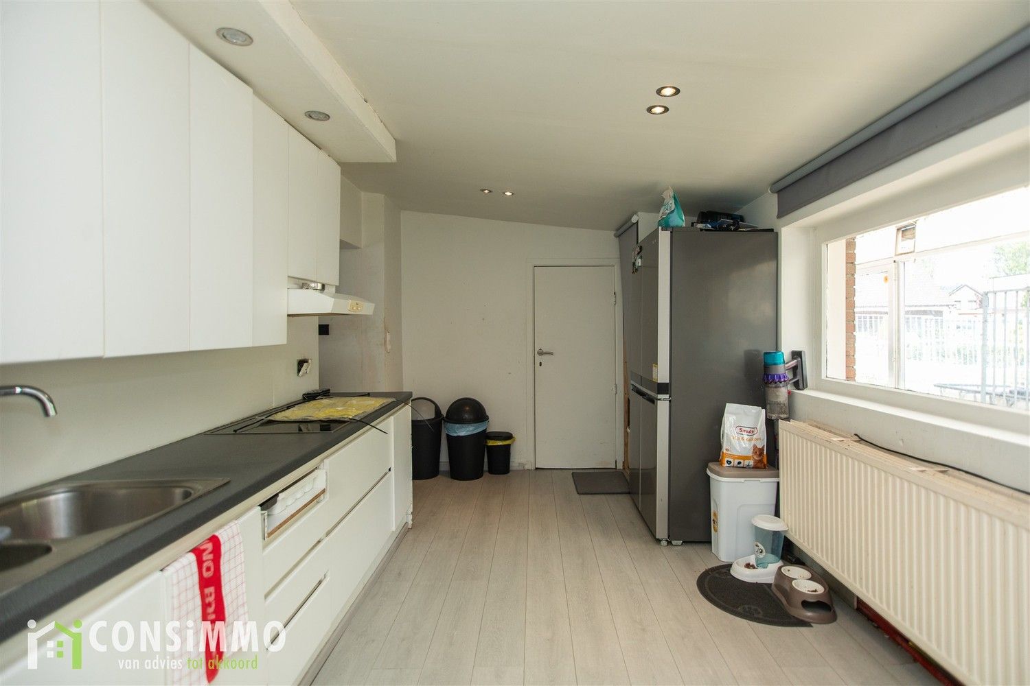 Gelijkvloerse woning met veel potentieel - vergunde nieuwbouwmogelijkheid in Genk foto 9