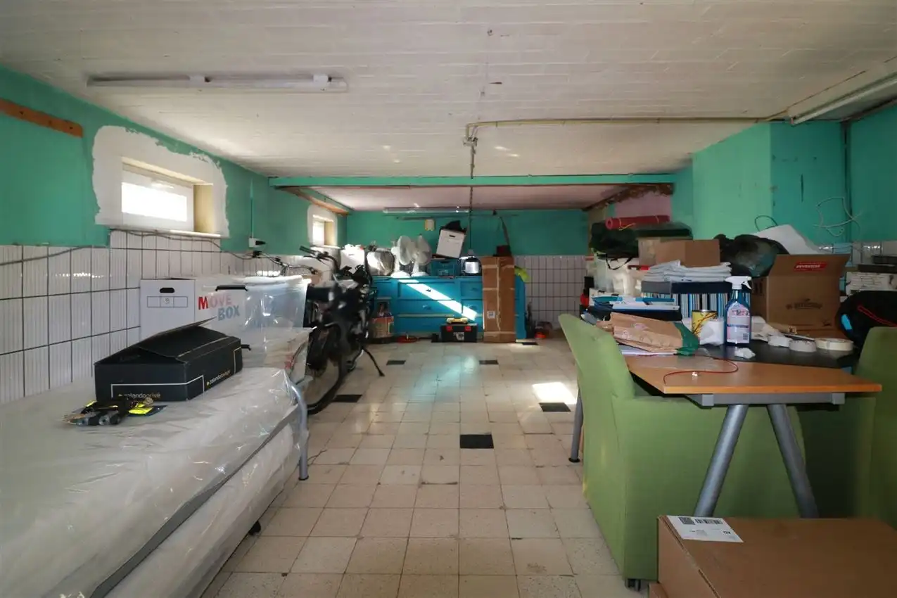 Gusting gelegen woning met 2 slpk, garage en tuin foto 26