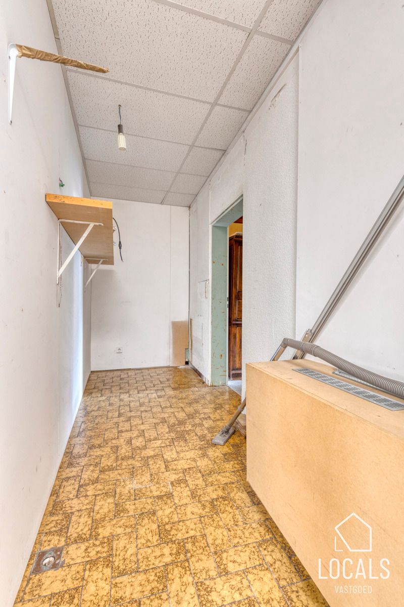 Handelspand met woonst, tuin en garage in centrum Ninove foto 10
