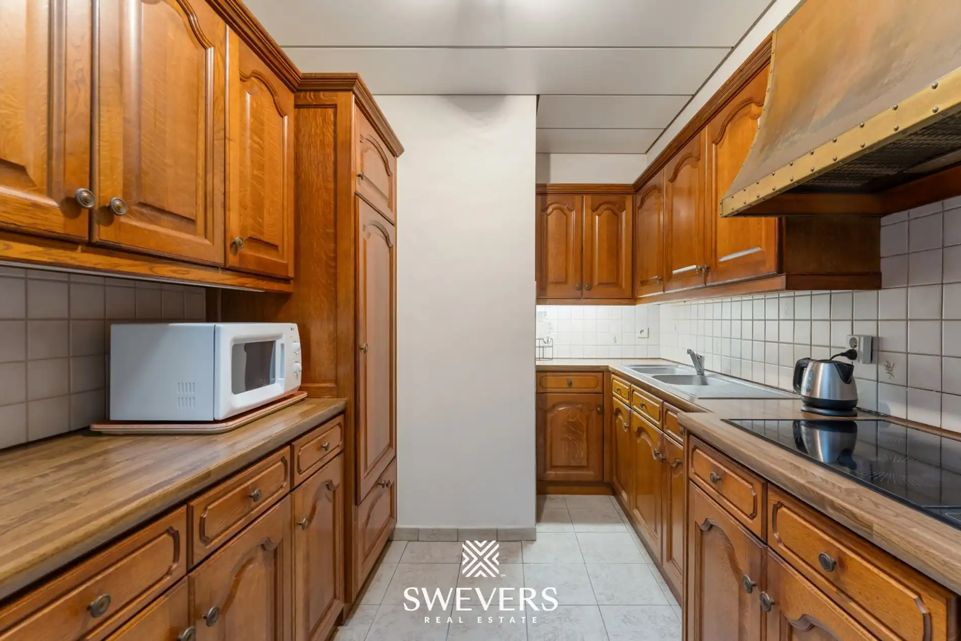 Opbrengsteigendom met handelspand, ruim appartement en uitbreidingspotentieel in hartje Heusden-Zolder foto 18