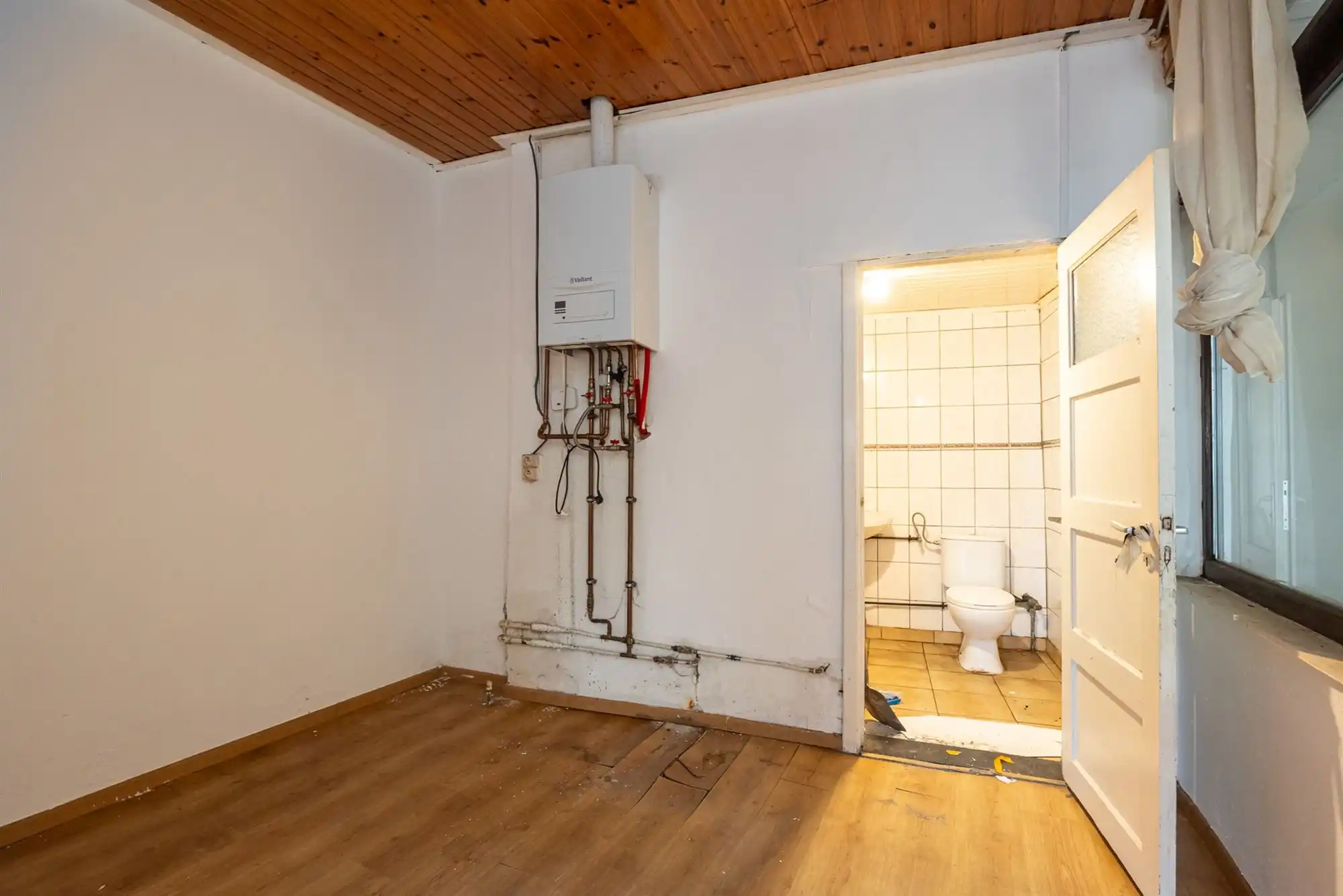 Te renoveren ééngezinswoning met 3 slpkrs, tuin en garage foto 10