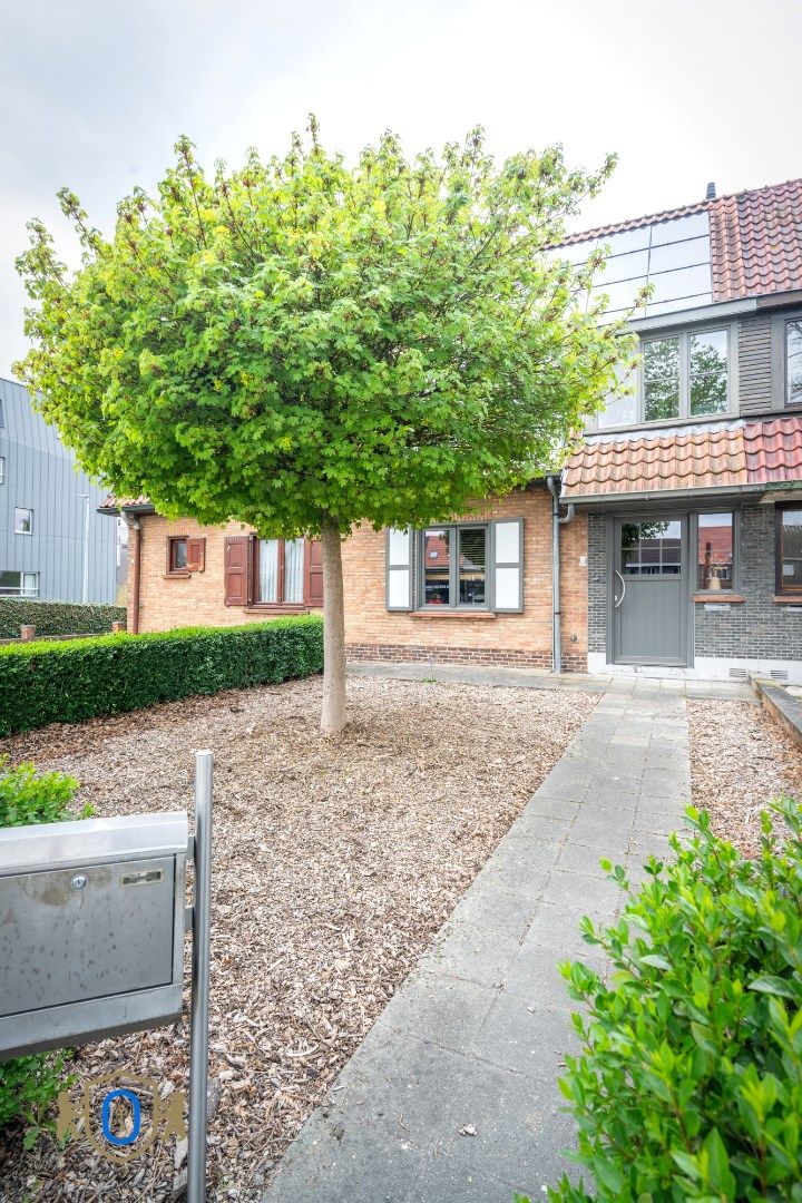 Charmante tussenwoning met tuin foto 2