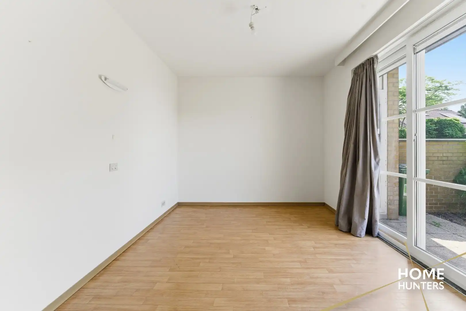 Instapklaar gelijkvloers appartement met 2 slaapkamers en ruime tuin foto 16