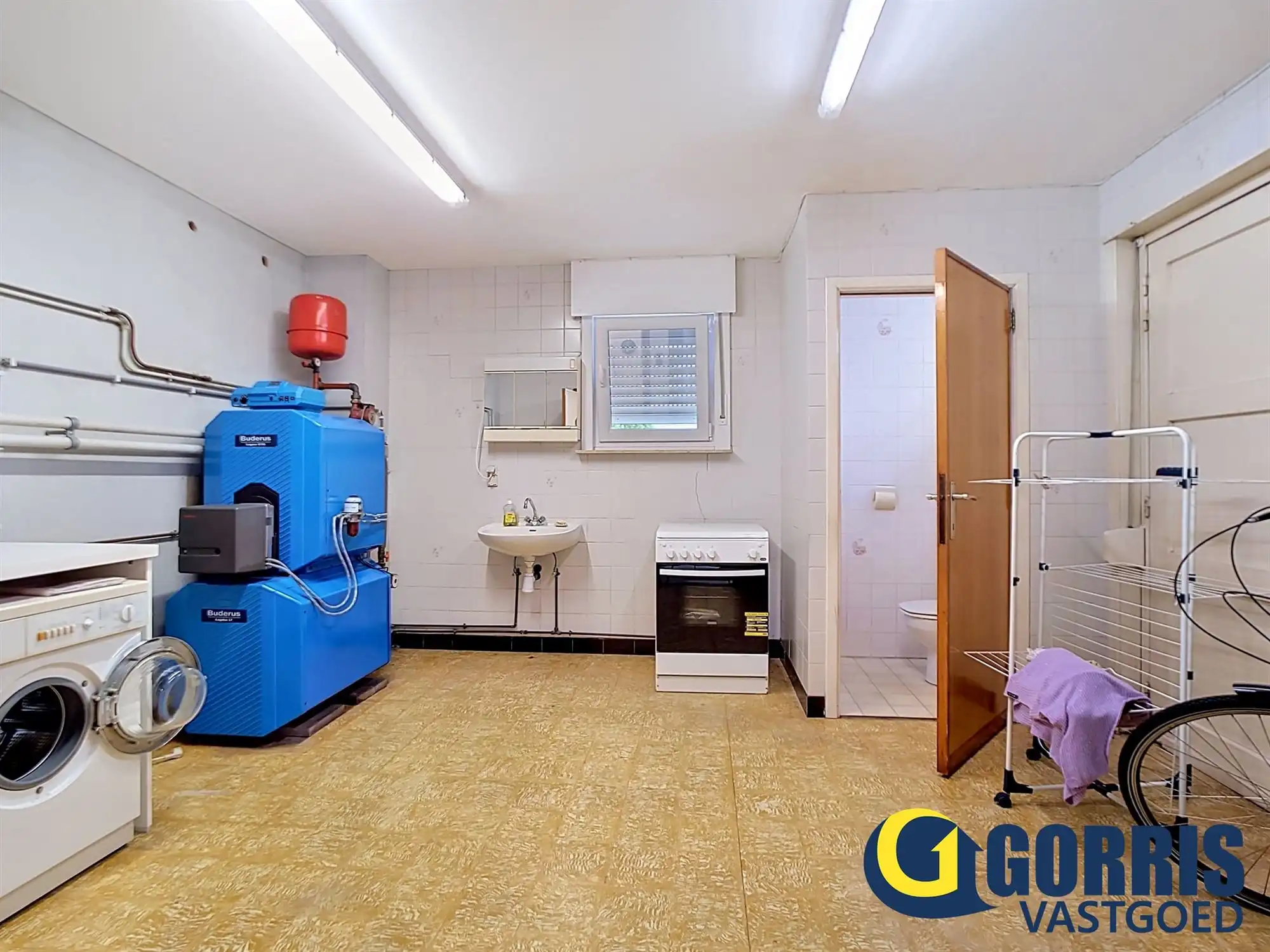 Te renoveren woning met ruime tuin in het centrum van Hulshout foto 6